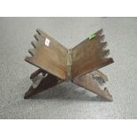 An ethnic wood fold away stand