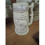 A ceramic tankard depicting fly fisherman and catch