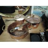 A selection of vintage copper cooking and stove pans