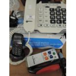 A selection of Aids to the elderly, large numeral and loud speaker telephone mobile phone, TV remote