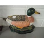 A cast door stop in the form of a Mallard Duck