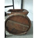 A vintage butter wooden churn