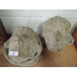 Two stone gargoyle heads