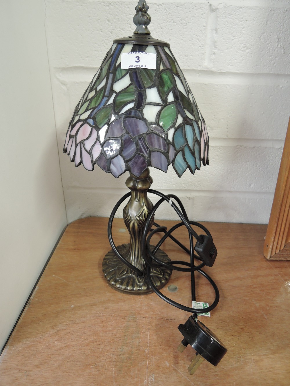 A Tiffany style table lamp and shade