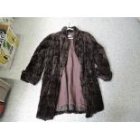 A vintage dark brown ladies fur coat having shawl collar