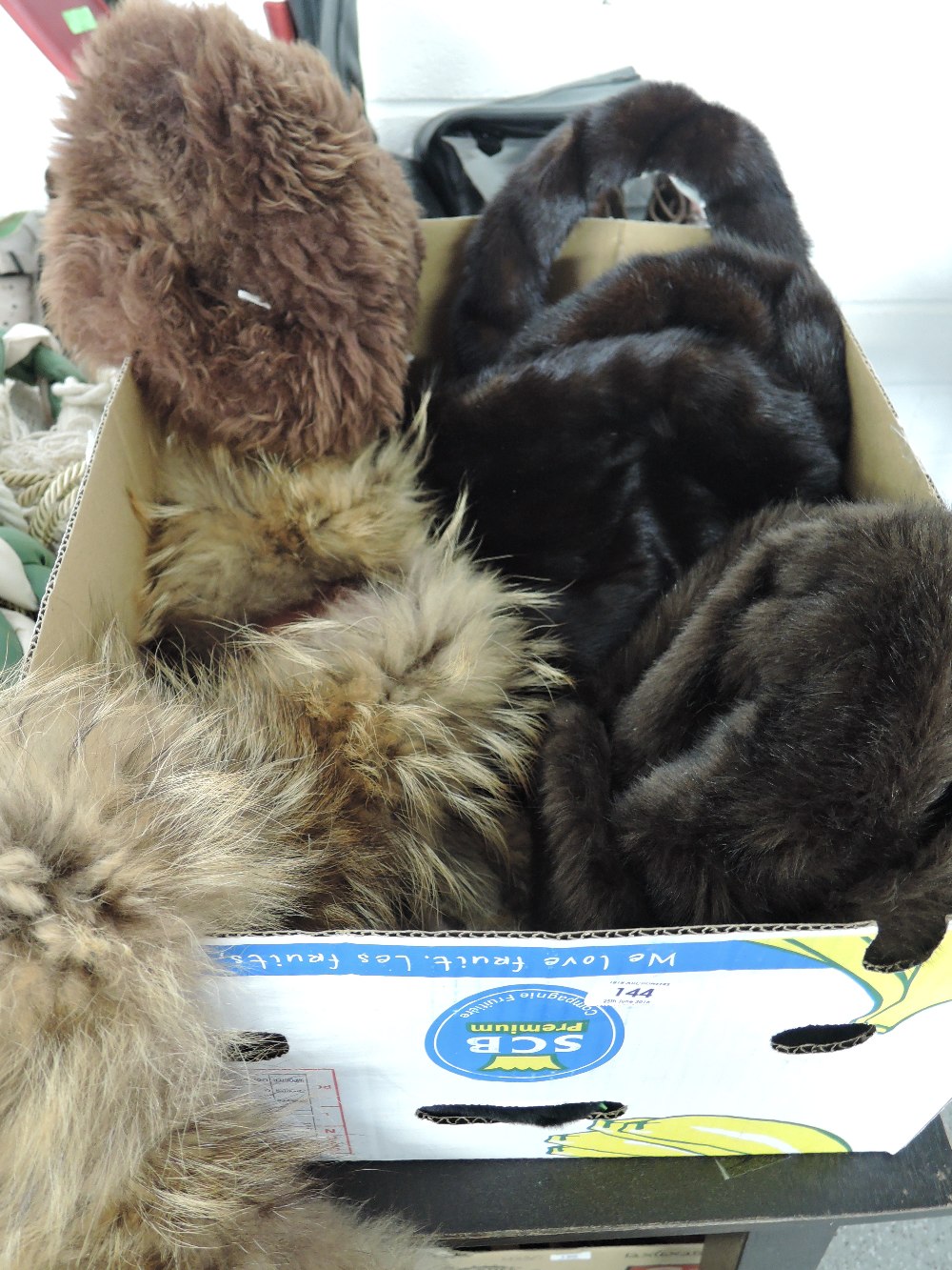 A selection of fur and faux fur items including stoles and hats etc
