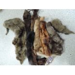 A bag of vintage fur hats and collars etc