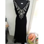 A black velvet evening gown by Murray Arbied of London having diamante detail to neckline and full