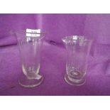 Two vintage measuring glasses