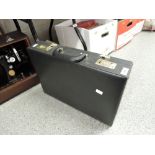 A vintage lockable leather briefcase