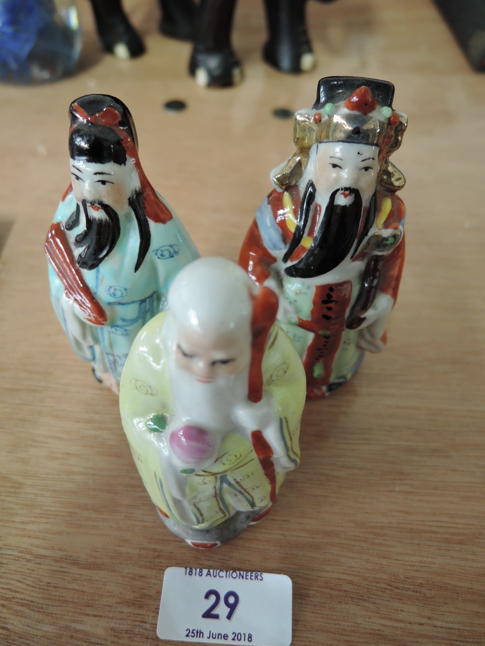 Three ceramic Chinese oriental figures, wisdom, wealth and old age