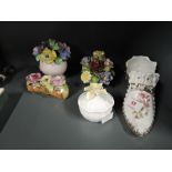 A selection of vintage ceramic decorations including shoe vase