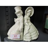 A pair of vintage ceramic book ends modelled as two gentleman and lady