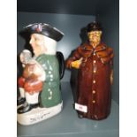 A vintage decanter in the form of a Town cryer with a doulton style design