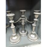 A selection of vintage plated candle sticks