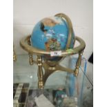 A semi precious gem stone globe of the world approx 20cm across and 30cm tall