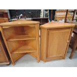 A modern corner cupboard and shelf unit in an Ercol design