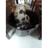 A vintage jam pan and dog