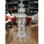 A modern model of a light house and glasses set