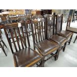 A set of four vintage dining chairs with twist work front