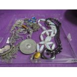 A selection of costume jewellery including hematite beads, tiger eye pendants, etc