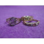 Two 9ct gold dress rings and a yellow metal ring stamped 9ct including two eternity style and