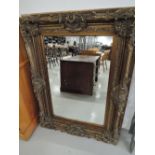 A large gilt frame wall mirror