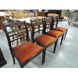 A set of four Edwardian style ladder back dining chairs