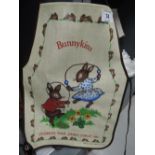 A vintage childs size apron with bunny kins print Royal Doulton