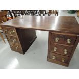 A vintage pedestal desk with hard wood top