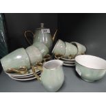 A vintage part coffee service with green lustre glaze