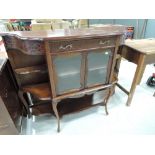 A reproduction chiffonier base in a regency design