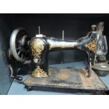A vintage Liddell and sons of Haltwhistle Northumberland hand cranked sewing machine with printed