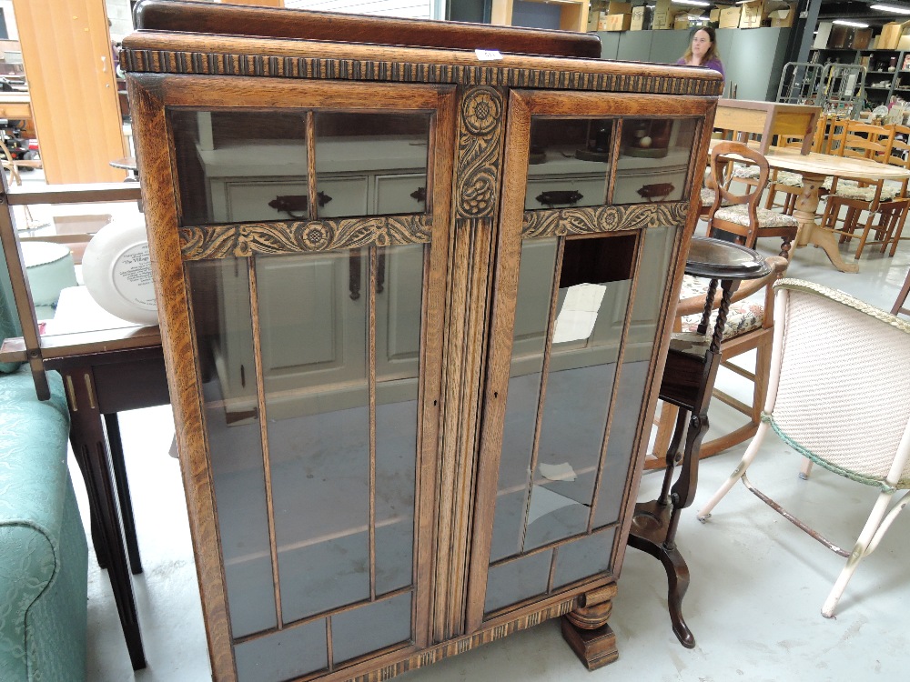 A vintage oak book case with glass front