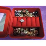 A small jewellery box containing cufflinks and earrings etc