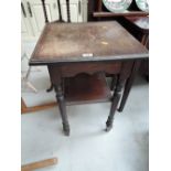 An early 20th century oak side table