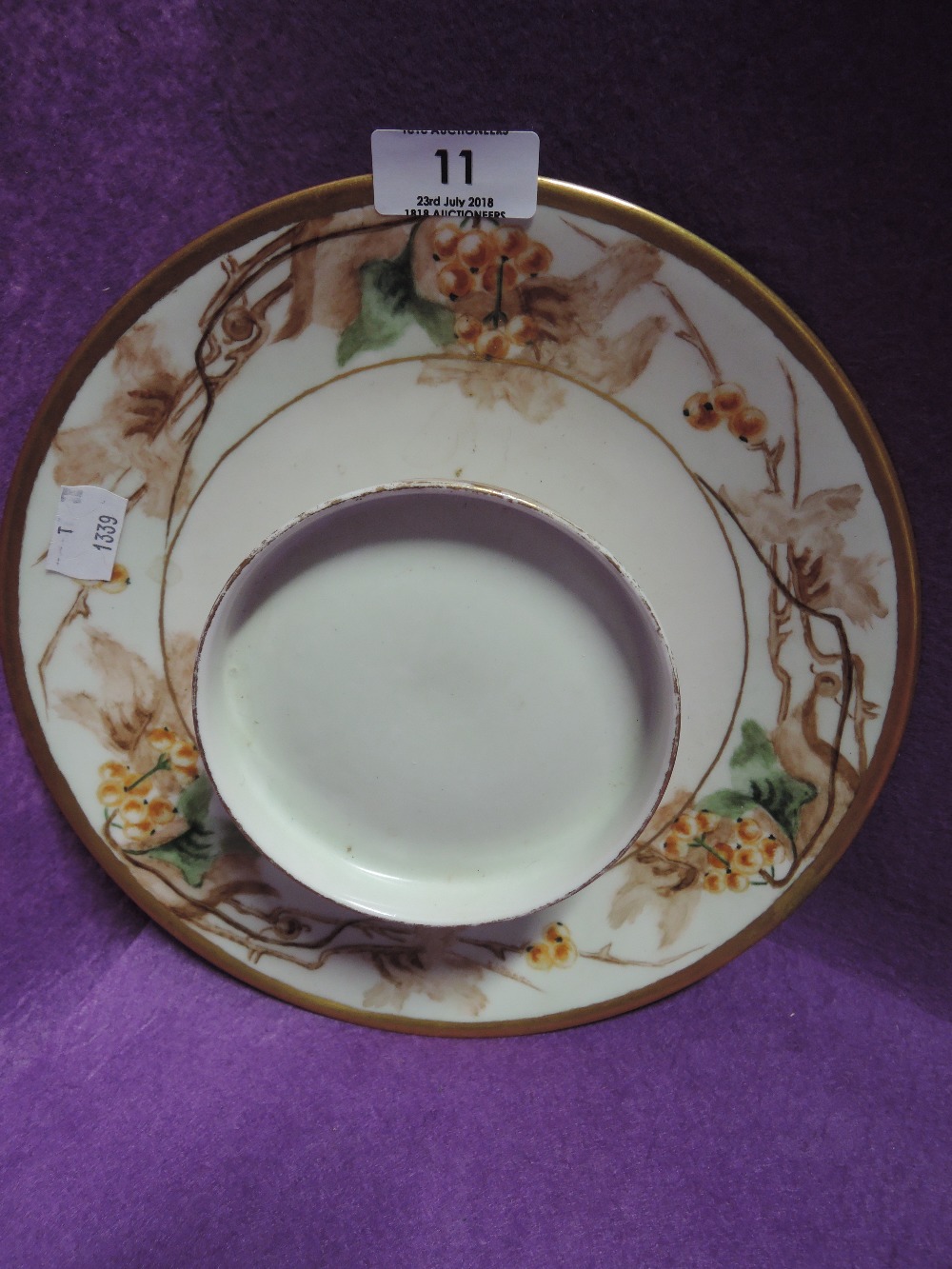 A vintage ceramic hand decorated plate by Limoges