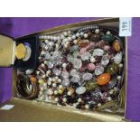 A box of costume jewellery including beads, bangles etc