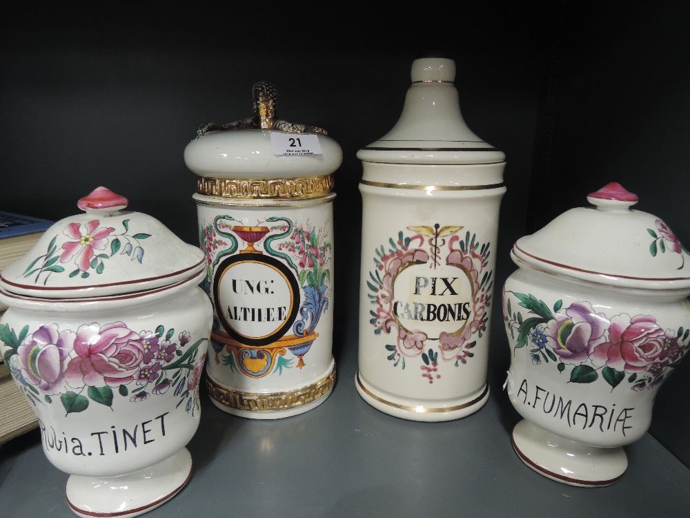 Four decorative lidded containers or apothecary jars