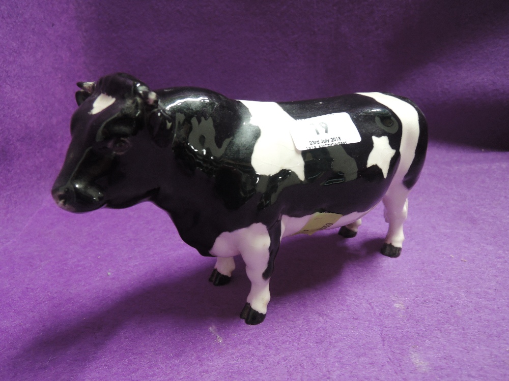 A vintage cow figure by Beswick
