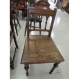A vintage vestibule chair oak with turned details