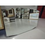 A vintage hallway or mantle mirror with art deco design