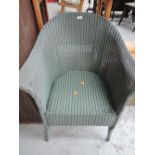 A vintage woven fibre chair with green finish
