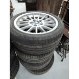 A set of car tyres and alloy rims BMW
