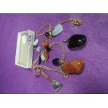 A small selection of polished mineral jewellery including pendants, earrings etc