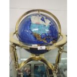 A large semi precious gem stone globe of the world with Lapis sea base approx 50cm wide 45 cm tall