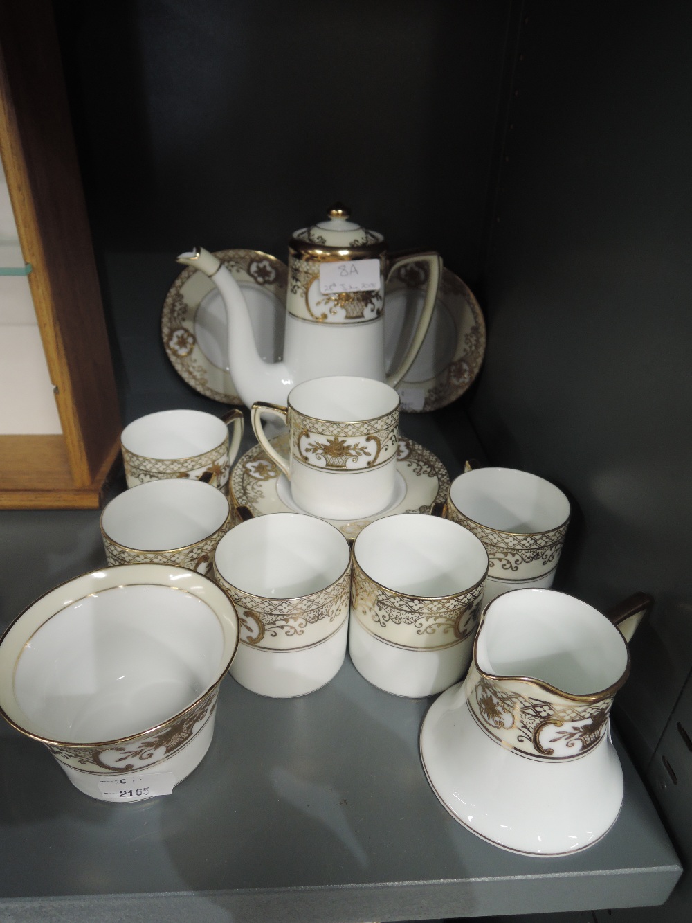 A Noritake coffee service in cream and gilt on a white ground