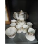 A Noritake coffee service in cream and gilt on a white ground