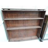 A vintage bookshelf with adjustable peg shelf by Wearing and Gillows