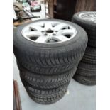 A set of car tyres and alloy rims